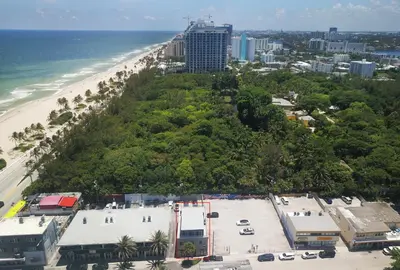 an aerial view of the beach and the ocean at Coastal Collection in Fort Lauderdale