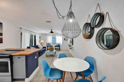 a kitchen and living room with a table and chairs at Casa Sol B in Fort Lauderdale