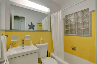 a bathroom with a sink and a toilet and a bath tub at Casa Sol A in Fort Lauderdale