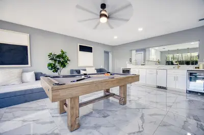a large living room with a pool table in it at Riverbend Yacht Retreat Waterfront Villa with Pool in Fort Lauderdale