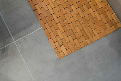a wooden mat on the floor of a bathroom at Miami Modern Studio minutes to Wynwood & Downtown in Miami