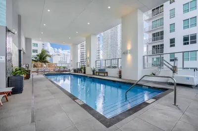 a swimming pool in the middle of a building at CAL KING BED Downtown Miami Free Parking Pool Gym in Miami