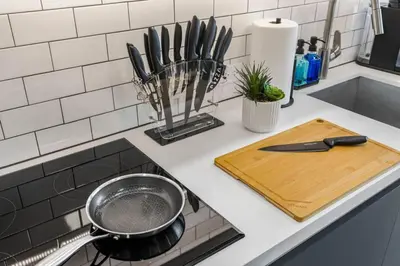 a kitchen counter with a pan on a stove at KING OF MIAMI - Downtown Free Parking Pool Gym in Miami