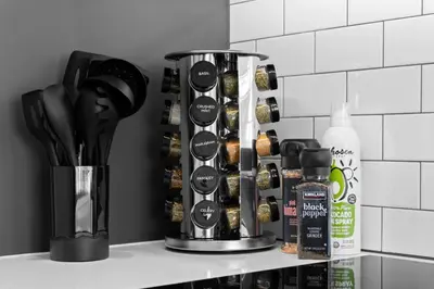 a kitchen counter with a rack of cooking utensils at KING OF MIAMI - Downtown Free Parking Pool Gym in Miami