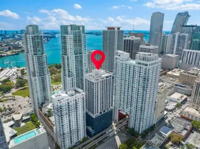 an aerial view of a city with a red marker on a building at KING OF MIAMI - Downtown Free Parking Pool Gym in Miami