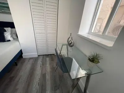 a room with a glass table and a bed at KING OF MIAMI - 1 mile from Brickell 2BD Apartment! in Miami