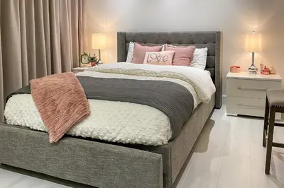 a bedroom with a large bed with pink pillows at Relax in the Sun! Gem 1 Mi to Las Olas Beach in Fort Lauderdale