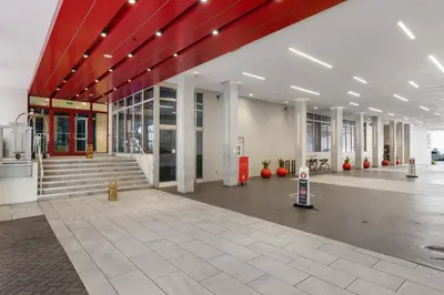 a large building with a lobby with red ceilings at Luxury Condo with Serene Balcony View in Hollywood