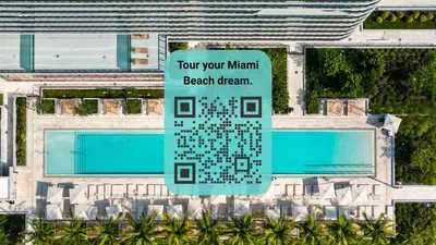 a sign in front of a building with a pool at 72 Park - Miami Beach Condo w Beach Access in Miami Beach