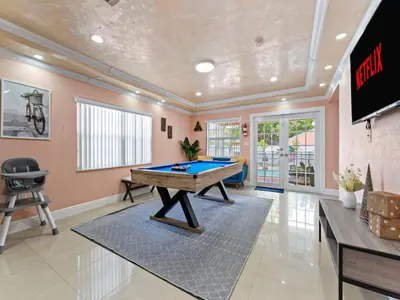 a large room with a pool table in it at Tropical Bay House-Near By Brickell, Wynwood and South Beach in Miami