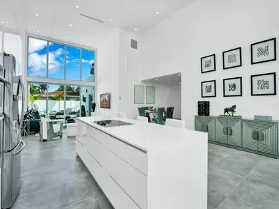 a kitchen with a white counter top and a refrigerator at Villa Coral Bay in Miami Beach