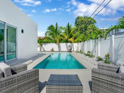 a swimming pool in the backyard of a house at Villa Coral Bay in Miami Beach