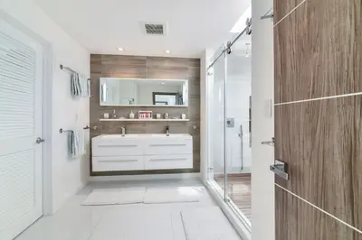 a bathroom with a shower and a white sink at Villa Moonlight Haven in Miami Beach