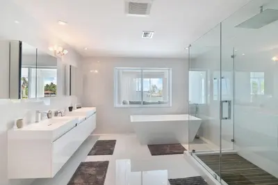 a bathroom with two sinks and a tub and a shower at Villa Moonlight Haven in Miami Beach