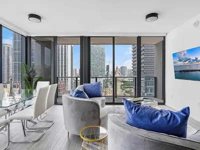 a living room with a view of a city at X Lounge VII-Private Sky Residence in Miami
