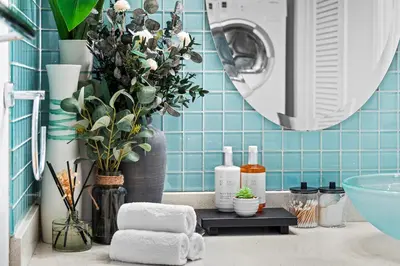 a bathroom with a washer and dryer on a counter at Roney Palace 408 in Miami Beach