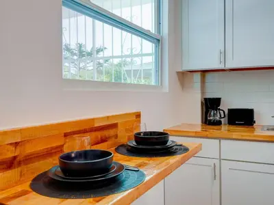 a kitchen with two black bowls on a counter at Miami Luxury Studio, Close to Wynwood and Beach in Biscayne Park