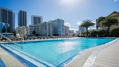 a large swimming pool in the middle of a city at Beachwalk Resort in Hallandale Beach