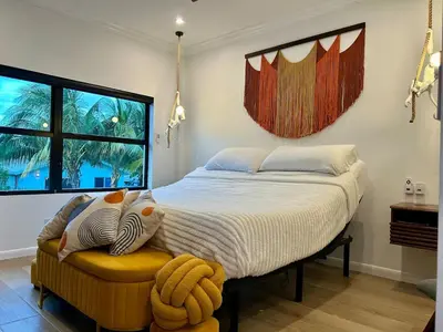 a bedroom with a large bed and a window at Home in Heart of Wilton Drive, 4 Mi to Beach in Fort Lauderdale