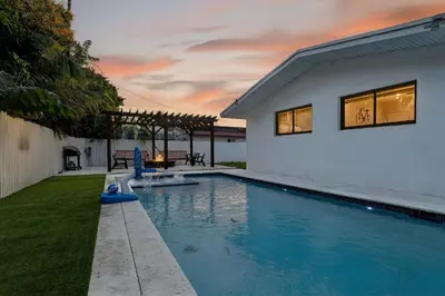 a swimming pool in the backyard of a house at Miami Private Pool Home 15 min to Beach - Aventura in Miami