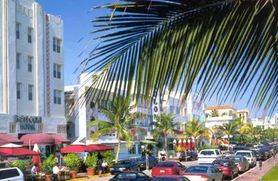 a busy street with cars parked in a city at The Blue Breeze - Parking included in Miami Beach
