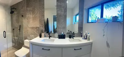 a bathroom with a sink and a shower at Luxury Miami home with heated pool & BBQ area, close to beaches & sports arenas in Miami