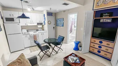 a kitchen and living room with a table and chairs at Ocean Front Studio - Miami Beach in Miami Beach