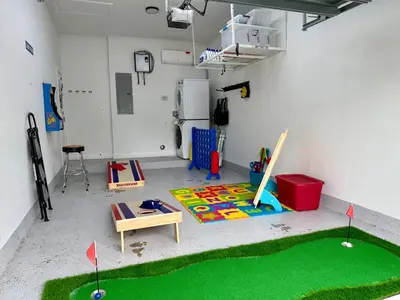a room with a play area with a miniature golf course at Oasis Yard -Pool-Jets-Game Room-BBQ-Relaxing in Carver Ranches