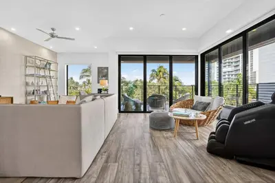 a living room with a couch and a table at Shoreline Villa by Rove - Rooftop & Beach Access in Hollywood