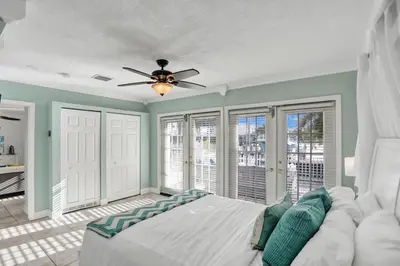 a bedroom with a bed and a ceiling fan at Waterfront, Heated Pool, Game Room in Fort Lauderdale