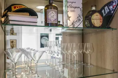 a glass shelf with wine glasses on it at Seaview Work Haven Condo for 6 in Miami