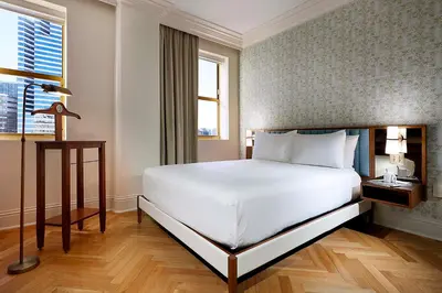 a bedroom with a large white bed and a window at Eurostars Langford in Miami