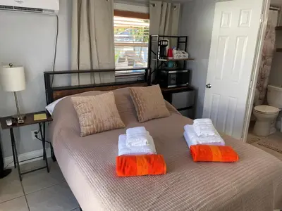 a bedroom with a bed with two towels on it at Aquaria in Fort Lauderdale