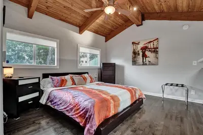 a bedroom with a bed and a ceiling fan at Fun Location! 1 block to Las Olas Pool & Parking in Fort Lauderdale