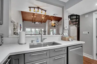 a kitchen with a sink and a counter top at Fun Location! 1 block to Las Olas Pool & Parking in Fort Lauderdale