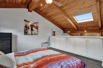 a bedroom with a bed and a wooden ceiling at Fun Location! 1 block to Las Olas Pool & Parking in Fort Lauderdale