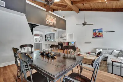 a dining room and living room with a table and chairs at Fun Location! 1 block to Las Olas Pool & Parking in Fort Lauderdale