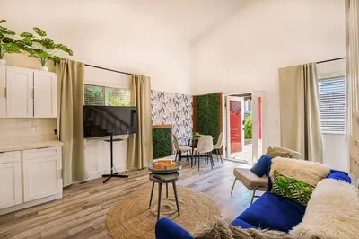 a living room with a blue couch and a table at Suite Mar - Unit B in Miami