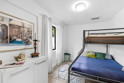a bedroom with a bunk bed in a room at Buena Vista vacation home with privacy and close to everything in Miami
