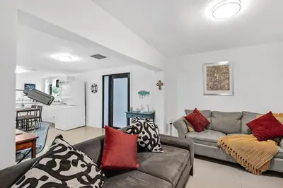 a living room with a couch and a kitchen at Buena Vista vacation home with privacy and close to everything in Miami