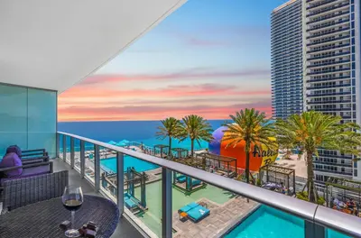 a balcony with a view of the beach and the ocean at Lyfe Resort l Ocean Pool View Gym, Beach Access in Hollywood