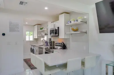 a kitchen with white cabinets and a white counter top at Couples Retreat 1 Mi to Fort Lauderdale Riverwalk in Fort Lauderdale