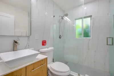 a bathroom with a toilet and a sink and a shower at Couples Retreat 1 Mi to Fort Lauderdale Riverwalk in Fort Lauderdale