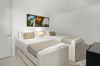 two beds in a white room with at OceanView 1B Private Residence at South Beach - 514 in Miami Beach