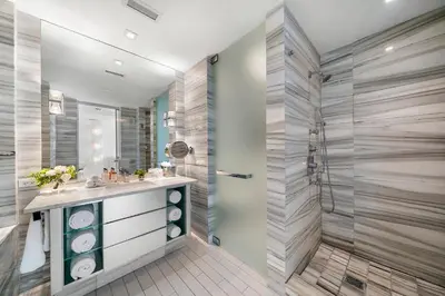 a bathroom with a sink and a shower at OceanView 1B Private Residence at South Beach - 514 in Miami Beach