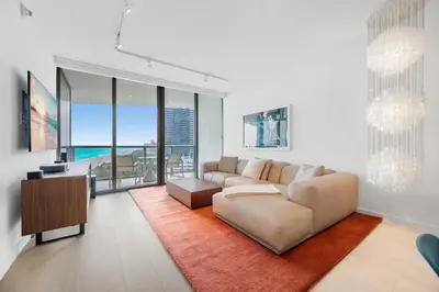 a living room with a couch and a table at OceanView 1B Private Residence at South Beach -1614 in Miami Beach