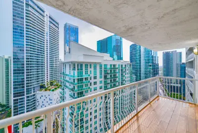 a balcony with a view of a city with tall buildings at Modern Waterfront Apartment with Brickell City Views in Miami