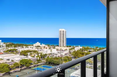 a balcony with a view of a city and the ocean at Beautiful Apt -Private Balcony & Pool in Miami Beach