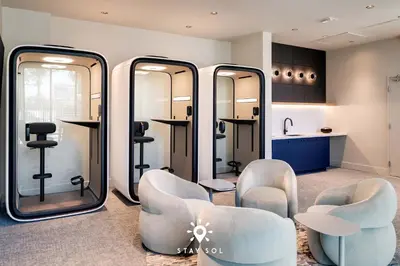 a salon with mirrors and chairs in a room at Coastal Apartment - Pool & Breezy Balcony in Miami Beach