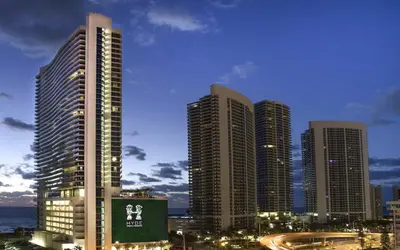 a group of tall buildings in a city at night at Lyfe Resort & Residences in Hollywood